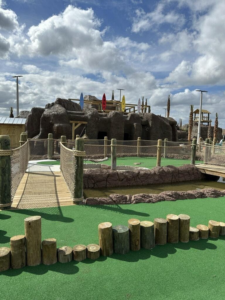 Mini golf course with themed rock structure