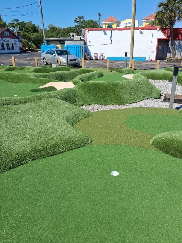 Miniature golf course with sand bunkers
