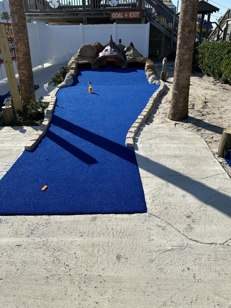 Mini golf course with monster mouth entrance